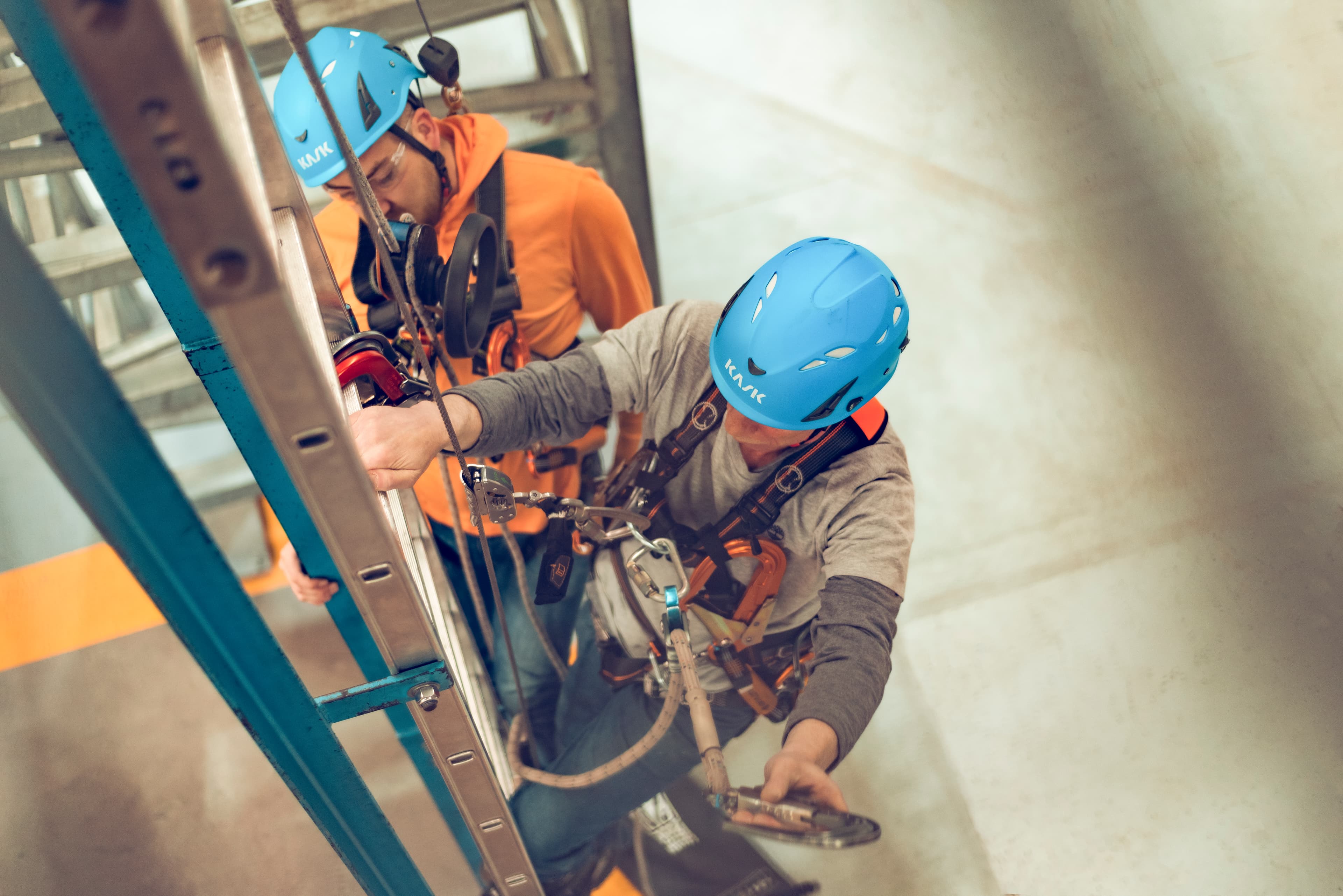 GWO Working at Height Training: Participants practice safe climbing techniques using fall protection equipment during a Global Wind Organisation (GWO) Working at Height training session