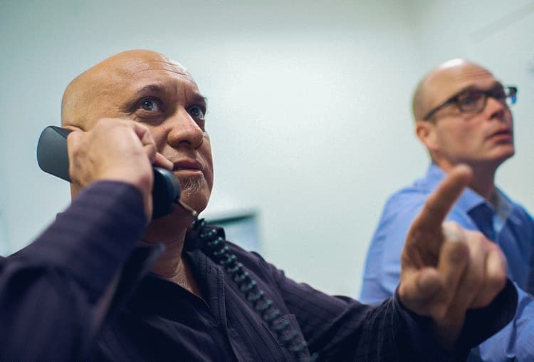 Operational team in a control room, demonstrating real-time decision-making and communication, ensuring smooth and safe execution of activities